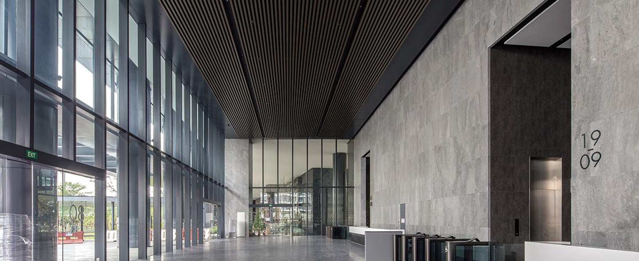 Commercial building lobby with security turnstiles