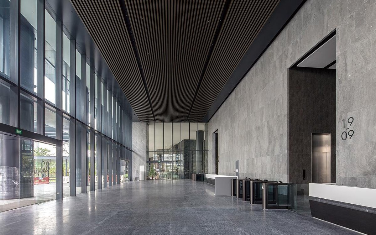 Commercial building lobby with security turnstiles