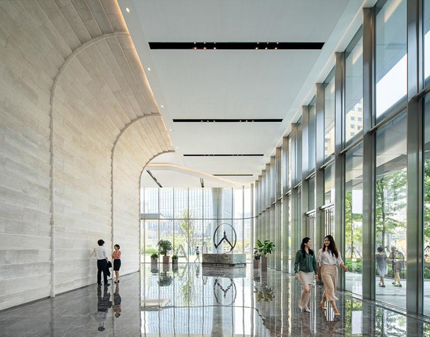 People walking through a commercial office lobby